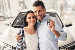 couple holding new car keys